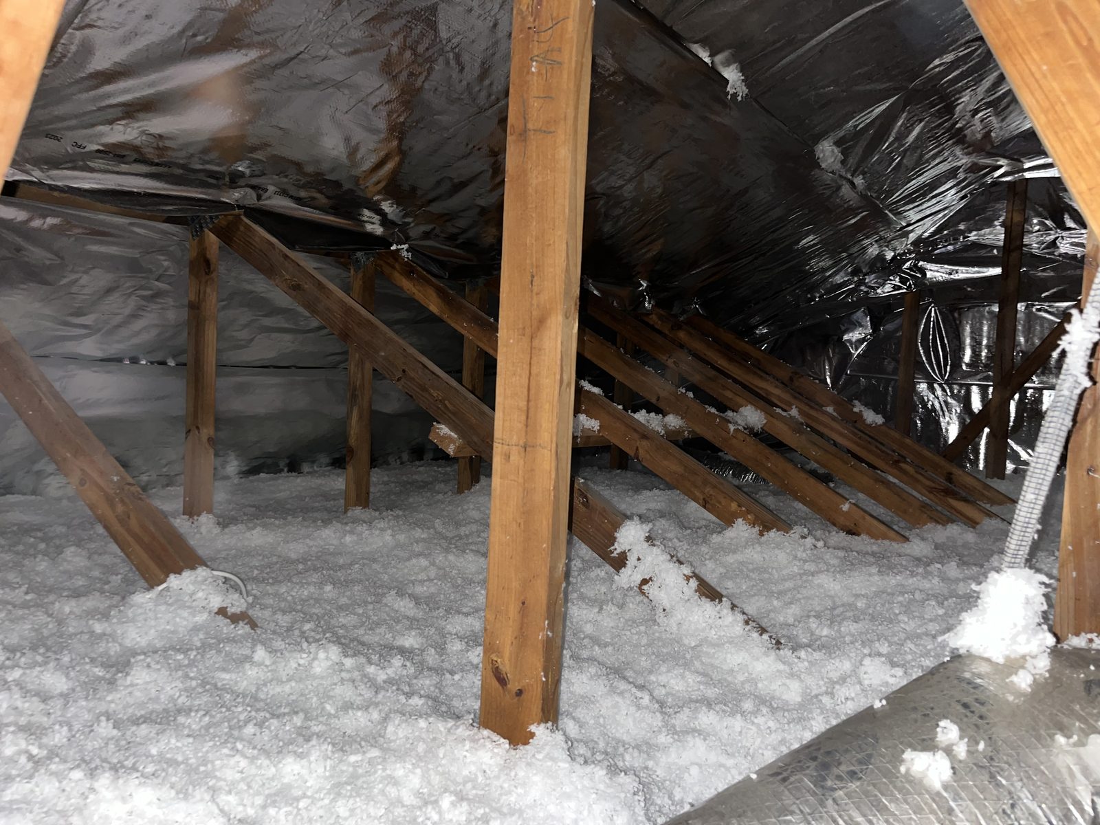 Finished attic insulation installation in a Central Florida house