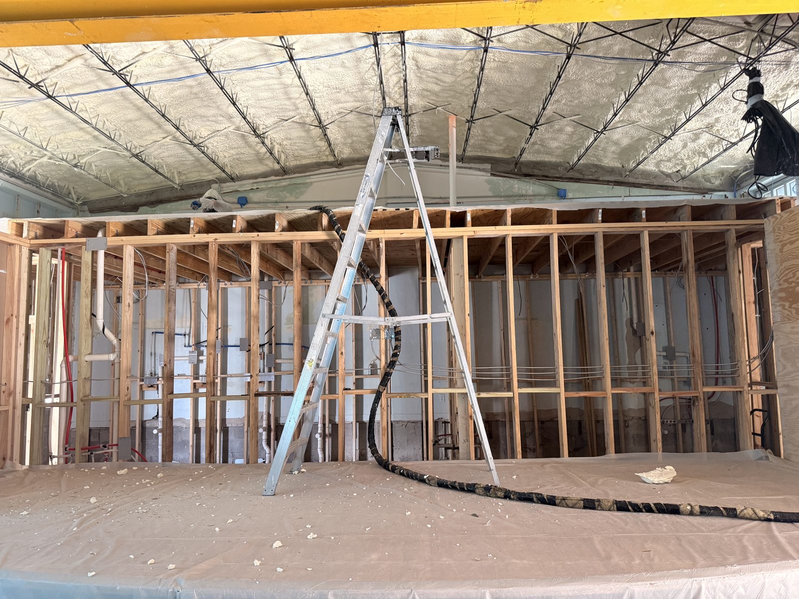 Spray foam insulation applied along ceiling joists in a Central Florida property